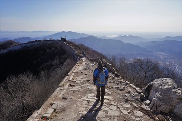 Great wall of China and mountains at Jiankou with hiking man