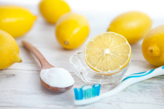 Organic cleaners, baking soda, lemon, tooth brush