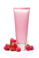 Pink cosmetic tube with strawberry and raspberry on white background