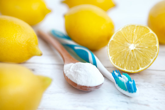 Spoon with baking soda and lemon