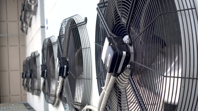 Air conditioner unit fan rotating. slowly rotates clockwise. winter