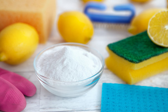 Baking soda, lemon and cleaning accessories