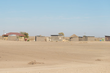 Mud straw and wooden hut with thatched roof in the bush. Local village in the rural Caprivi Strip, the most populated region in Namibia, Africa.