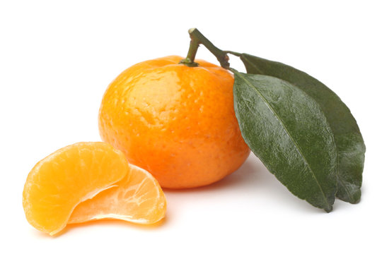 Ripe tangerine with green leaves