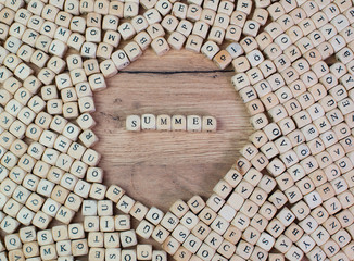 Summer name in letters on cube dices on table