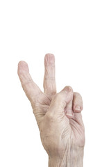isolated wrinkled hand of an old person making victory sign on white
