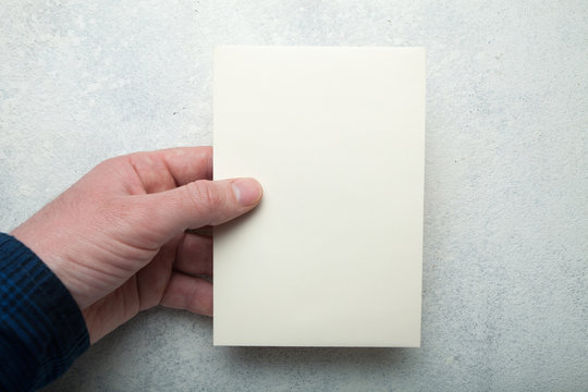 Beige vintage sheet of paper in a European hand on an old white background. Copy space.