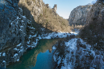 Fototapeta na wymiar bridge old in Ioannina Zagori Greeece snow ice winter time