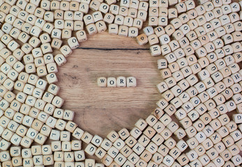 Work name in letters on cube dices on table