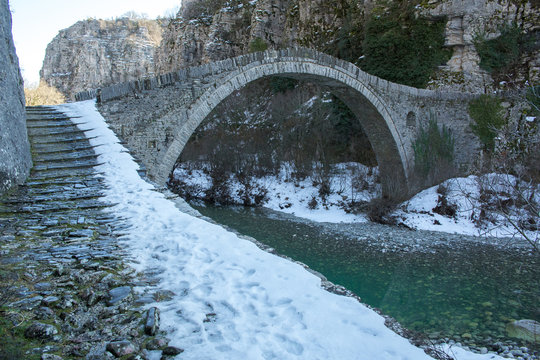 bridge old in Ioannina Zagori Greeece snow ice winter time