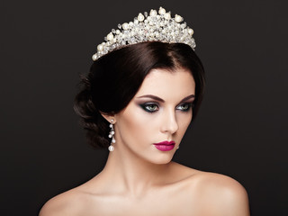 Fashion Portrait of Beautiful Woman with Tiara on head. Elegant Hairstyle. Perfect Make-Up and Jewelry. Red Lips © Oleg Gekman