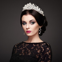 Fashion Portrait of Beautiful Woman with Tiara on head. Elegant Hairstyle. Perfect Make-Up and Jewelry. Red Lips © Oleg Gekman
