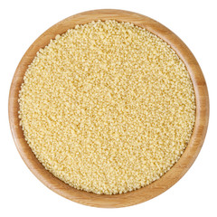Uncooked couscous in wooden bowl isolated on white background with clipping path