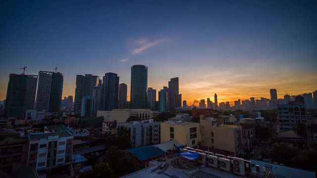 The capital of the Philippines is Manila. Makati city. Early dawn in the city.