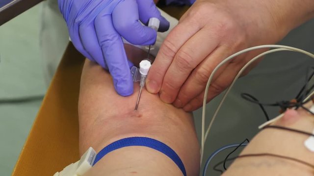 a needle stick into a vein