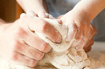 Fototapeta premium Hands knead the dough.