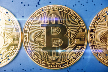 Bitcoin on a blue background. E-Commerce cryptocurrencies. Concept of technologies of virtual currencies