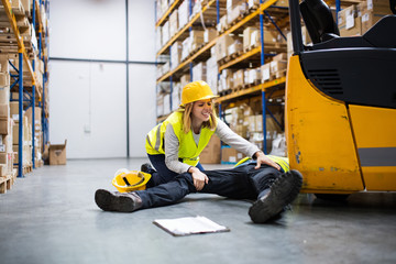 An injured worker after an accident in a warehouse.