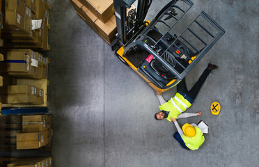 Warehouse workers after an accident in a warehouse.