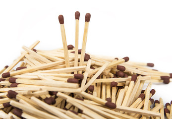 Match sticks with brown heads in stacks .  Matches texture background