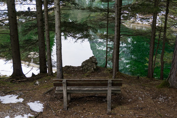 Bench overlooking the beautiful, pristine waters of the Gruener See in Austria