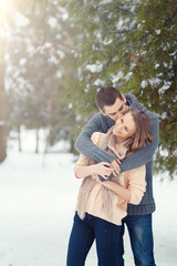 Fototapeta premium Happy Couple Having Fun Outdoors. Snow. Winter Vacation. Outdoor