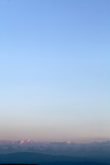 Fototapeta premium pink clouds over the horizon on sunrise