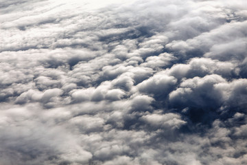 Clouds seen from airplane, concept of weather and climate change, cyclones and anticyclones
