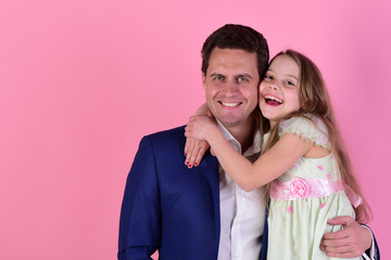 Girl and man with happy smiling faces on pink background
