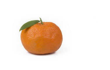 Tangerine or clementine with green leaf isolated on white background