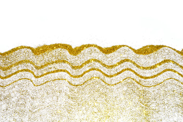 Abstract wavy laces of golden glitter sparkles on white background, decorative sequins for your design