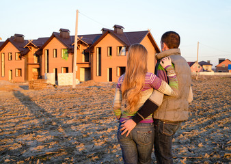 loving couple looking at their home.