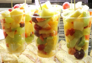 Deurstickers glasses filled with fruit salad with pineapple cherry pears grapes apples © ChiccoDodiFC