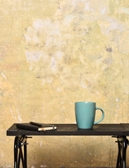 cup with copybook and pen