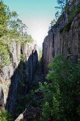 Deep gap, ravine in a cliff.