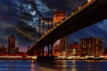 Manhattan Bridge illuminated at dusk very long exposure