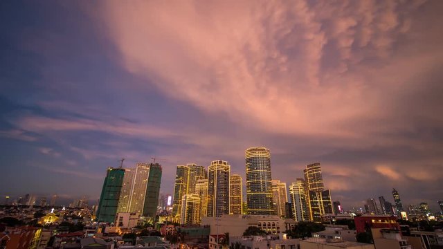 The capital of the Philippines is Manila. Makati city. Beautiful sunset with thunderous powerful clouds.