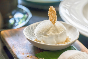 White milk cream on wooden spoon top view surface