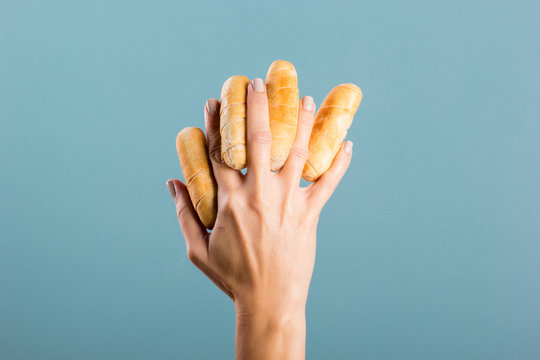 woman's hand holding cheese fingers