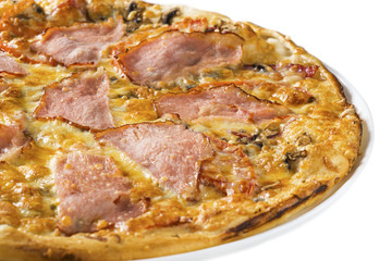 Tasty pizza with ham, mushrooms and tomato