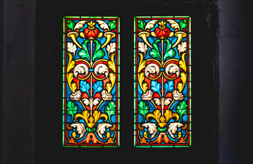 coloured stained glass in dark background