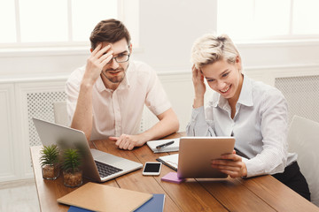 Obraz premium Couple of young business partners working at modern office