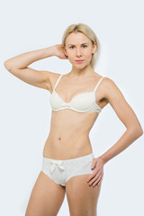 Obraz premium Beautiful slim tanned woman in underwear