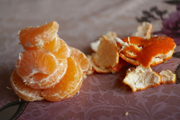Fresh peeled tangerine on a table