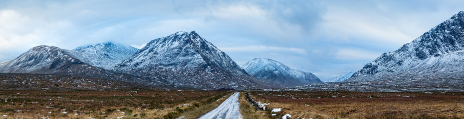 Fototapeta na wymiar landscape view of scotland and the entrance to glen etive near buchaille etive mor in winter in panoramic landscape format