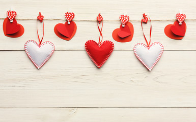 Valentine day background, handmade pillow hearts on wood, copy space