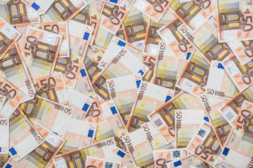 50 new and old euro bills as background