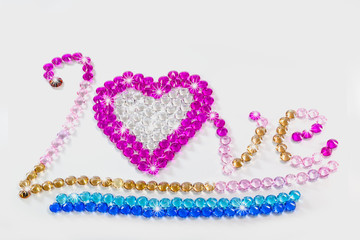 wrote love with colorful diamonds