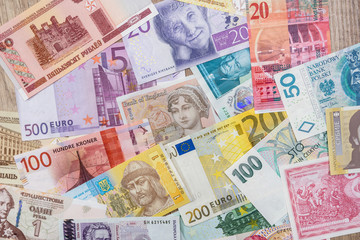 different money europe country as background
