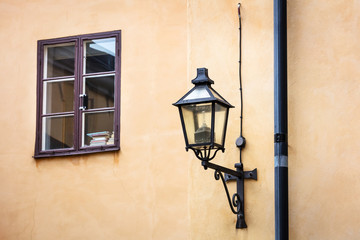 Fototapeta na wymiar street lamp and a window